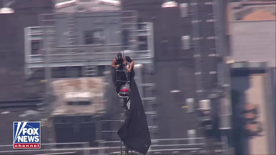 BREAKING: Two people have climbed to the top of the Empire State Building in New York City, holding a banner from the skyscraper's antenna reading, "When the power of love beats the love of power, the world knows peace."

As of now it's unclear how the pair reached the top of the building as police work to get them down from the spire, 1,454 feet above the ground.