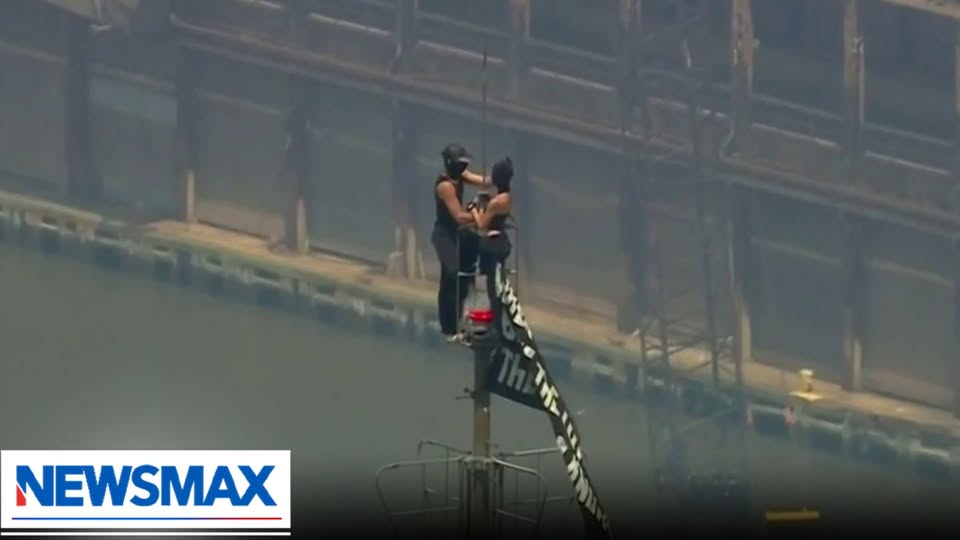 BREAKING: Two masked individuals have climbed to the top of NYC’s Empire State Building and unfurled a banner reading, “When the power of love beats the love of power, the world knows peace.”