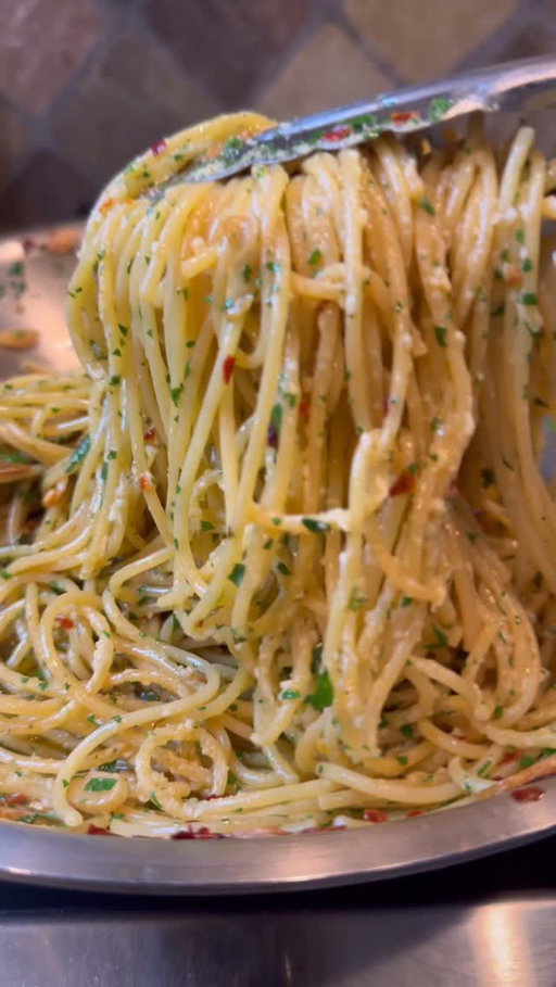 The Bougiest 10-minute struggle meal ever has to be Spaghetti Aglio e Olio 🍝 After a late night out, nothing hits quicker or better—just a handful of simple ingredients, ready in minutes. Foolproof, fast, and way fancier than it should be 🤤 

Spaghetti Aglio e Olio

Ingredients

1 tsp kosher salt (for pasta water)

1 lb dried spaghetti

1/3 cup extra virgin olive oil

8 large garlic cloves, thinly sliced

1 tsp crushed red pepper flakes

1/2 cup minced fresh parsley

1 cup freshly grated Parmesan cheese

Instructions

1. Cook the Spaghetti

1. Bring a large pot of salted water to a boil.

2. Add the spaghetti and cook according to the package instructions.

2. Prepare the Sauce

1. Heat the olive oil in a large, light-colored pan over medium heat.

2. Add the garlic and cook, stirring frequently, until it begins to turn golden (about 1-2 minutes).

3. Stir in the crushed red pepper flakes and cook for an additional 30 seconds.

4. Turn off the heat.

3. Combine Pasta and Sauce

1. Add the spaghetti directly from the pot into the pan with the garlic and chili oil.

2. Stir in a few tablespoons of the pasta water as needed to coat the spaghetti evenly.

4. Finish and Serve

1. Toss in the minced parsley and freshly grated Parmesan cheese.

2. Mix well to combine, letting the pasta sit for a few minutes to absorb the flavors.

3. Serve warm, with extra Parmesan on the side.

#pasta #spaghetti #italianfood #easyrecipes #food #foodie #foodstagram #instafood #foodlover #cooking