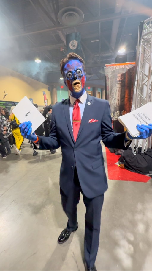👓 They Live comes to life! This alien from John Carpenter’s cult classic was spotted at @midsummerscream , spreading those iconic messages: OBEY and DO NOT QUESTION AUTHORITY. Such a perfect cosplay throwback to one of the most legendary horror/sci-fi films ever. @illusion_alchemy killed this! #MidsummerScream 

#TheyLive #JohnCarpenter #Obey #HorrorCosplay #SciFiHorror #CultClassic #MidsummerScream #CosplayCommunity #ConventionLife