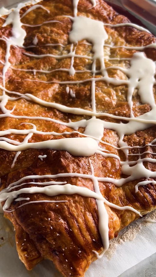 Bookmark this for the next time you’re hosting brunch. Here’s how to make @yossyarefi’s Giant Strawberry Turnover:

• 1 pound strawberries, hulled and thinly sliced
• ½ cup strawberry jam
• 1 tablespoon cornstarch
• 1 teaspoon vanilla extract
• Pinch kosher salt
• 1 large egg
• All-purpose flour
• 1 (14- to 18-ounce) package frozen puff pastry, thawed overnight in the refrigerator
• 1 tablespoon turbinado or granulated sugar
• 1 cup powdered sugar
• 2 tablespoons unsalted butter, melted
• 1 to 2 tablespoons warm milk
• 1 teaspoon vanilla extract
• Kosher salt

Heat oven to 425 degrees. In a large bowl, combine sliced strawberries, strawberry jam, cornstarch, vanilla and salt. Stir gently. Beat the egg in a small bowl with a splash of water.

On a lightly floured piece of parchment paper, roll one of the puff pastry sheets into a roughly 10-by-14-inch rectangle (if using puff pastry that came as a single sheet, cut the sheet in half crosswise and roll one half into a 9-by-13-inch rectangle). Transfer the rolled-out pastry on the parchment to large baking sheet. Brush a 1-inch border of egg wash around the pastry. (Keep second pastry sheet in the refrigerator until ready to use.)

Distribute the strawberry mixture over the pastry, keeping the border clear of fruit and juices.

On a lightly floured surface, roll out the remaining sheet of puff pastry into another 10-by-14-inch rectangle (if using puff pastry that came as a single sheet, roll out the second half of the pastry into another 9-by-13-inch rectangle). Pick up the sheet and place it on top of the pastry and filling on the baking sheet. Use a fork to crimp edges. Brush top with remaining egg wash and sprinkle with sugar.

Bake for 20 to 25 minutes, until deep brown. It will puff up dramatically in the oven. Cool the turnover on the baking sheet set on a wire rack.

After about 10 minutes, when the turnover is warm, make the glaze: In a medium bowl, whisk together powdered sugar, melted butter, 1 tablespoon milk, vanilla and a pinch of salt. Add more milk as needed to make an opaque but runny glaze.

Drizzle the glaze over the turnover, then use a long, sharp knife to cut into 8 pieces. Serve immediately.
