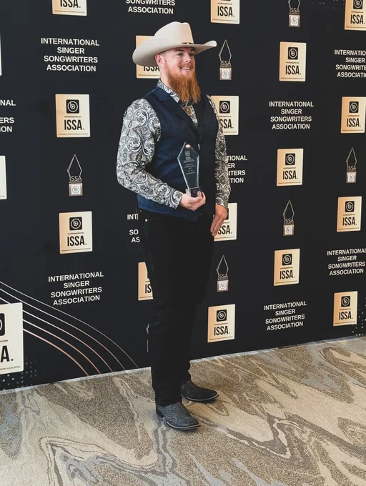 So... about last night.

I had the absolute honor of receiving the award for 'Rising Male Star' at the International Singer-Songwriter Association Awards in Atlanta, GA.

The ISSA Summit and Awards show were great experiences and opportunities. Coming down as a first time member, I had no expectations other than to connect and enjoy the camaraderie of independent artists.

Then, to our shock and appreciation, we were announced as the Rising Male Star of 2025. I'm incredibly honored of the recognition of our hard work and pursuit of excellence. The friends we've made this week will continue to grow and the collaborations are soon to follow! 

Thank you so much to the ISSA judges, Tamanie Dove, and the independent artists involved. I'll see y'all next year 🤙🏼

#CountryMusic #Awards #NicholasVernon #RisingMaleStar #NCArtist #LiveMusic #ISSA #Country