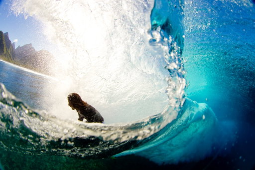 I’ve always chased ways to bring people closer to what it feels like in the water. A wide lens with an over-under port does just that. Surface tension splits the frame, and suddenly you’re inside two realities at once. Shots from around the world.

A quick tip if you want to have focus above and below water—> shoot f8 at a minimum.  This will allow you to have the depth of field to have sharp images underwater as well, all too often there’s soft focus underwater shots with sharp subject on surface….