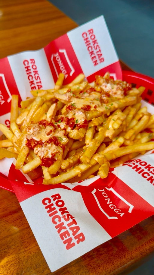 @rokstarchicken is currently collaborating with one of my favorite kimchi brands @jongga_usa so of course I had to go and try it out!

For their collaboration they’re featuring Jongga Crispy potato fries and a Jongga Kimchi chicken sandwich. Both items are served with caramelized Jongga kimchi and spicy ranch.

The fries weee nice crispy, thin, and was so bomb with the caramelized kimchi.  The chicken sandwich is always crispy and juicy and the kimchi was a great addition! You really can’t go wrong with either options so definitely get the combo so you don’t miss out.

Some classic I like to get are their fried shrimp (which I didn’t get this time) and their boneless fried chicken. I love their soy garlic and their Korean jalapeño mayo. I always get my chicken naked so I can dip it with both sauces! If you’re not a fan of sauce try out their honey butter.
#eatingwithblim #rokstarchicken #jongga #jonggakimchi #kimchi #korean #koreanfriedchicken #friedchicken #nyceats #koreannyc #nyckoreanfood #nycfood