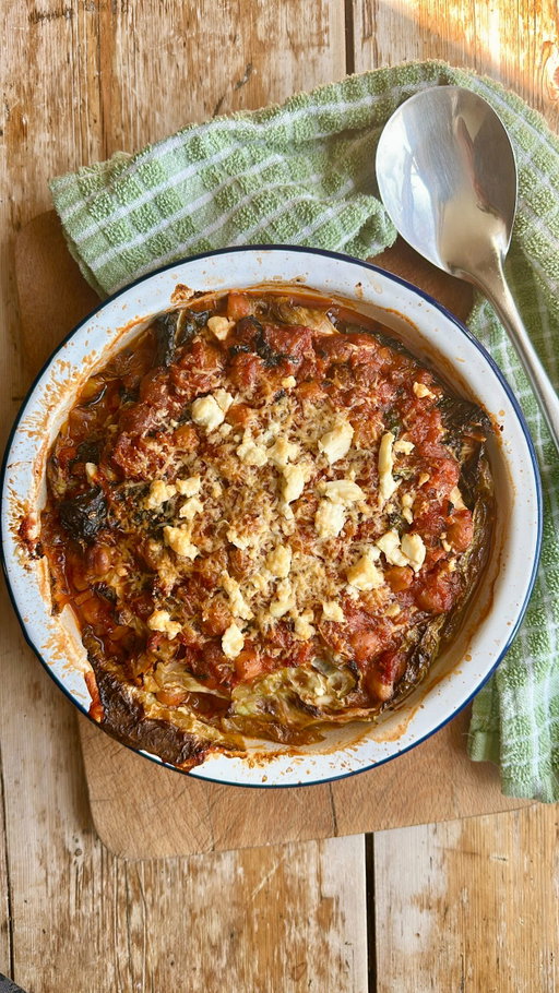 Cabbage & Chickpea Lasagna

#recipe ⬇️ 

It’s leftover day here at the cottage and what used to be something I didn’t really enjoy has turned into my favourite thing to do. 

As a foodie content creator I tend to have quite a lot of odds and sods knocking about in the fridge by the end of the month.  Look, I try and plan but sometimes I’ll buy something on a whim and then it just sits there lurking. This hispi cabbage is a good example of that but I had a lot of other things that needed using up. 

It all layered up beautifully with cheddar and feta and I was genuinely delighted with it. Which I think goes to show that either I’m a culinary genius and deserve some kind of, I dunno, award… or that buying those little things on a whim can be the best reward.

•	Olive oil and butter
•	½ onion – finely chopped
•	1 carrots – finely chopped
•	Fresh rosemary and thyme – chopped
•	1 clove of garlic – grated
•	1 bunch basil – chopped
•	1 x 400ml tin chopped tomatoes
•	½ tin water
•	A splash of white wine vinegar
•	A splash of white wine
•	1 x 325g jar baked beans in tomato sauce – I used @boldbeanco 
•	2 tablespoons red pesto
•	1 x 240g pouch chickpeas – I used @merchantgourmet 
•	1 hispi (loveheart) cabbage – roughly 9 leaves carefully removed
•	Feta cheese & finely grated strong cheddar

Place a large sautéing pan on a medium heat and add a little olive oil and butter, then add the onions and carrots and saute for a few minutes until soft.  Stir in the herbs and garlic and then add the tomatoes, water, vinegar, wine, beans, pesto and chickpeas.  Stir well and let it sit on a very low heat for at least 30 mins.  I stirred in some leftover kale about 10 minutes before the end of the cooking time.

Steam or boil the cabbage leaves for roughly 3 mins until just tender. Remove and drain well.

Layer the ‘lasagna’ starting with the cabbage leaves, then a bit of the sauce and some cheese.  Bake for 25 – 35 mins in the oven at 200°C (180ºC fan/400°F/Gas 6) until bubbling and golden on top.

#lasagna #cabbage #beans #vegetarian #leftovers