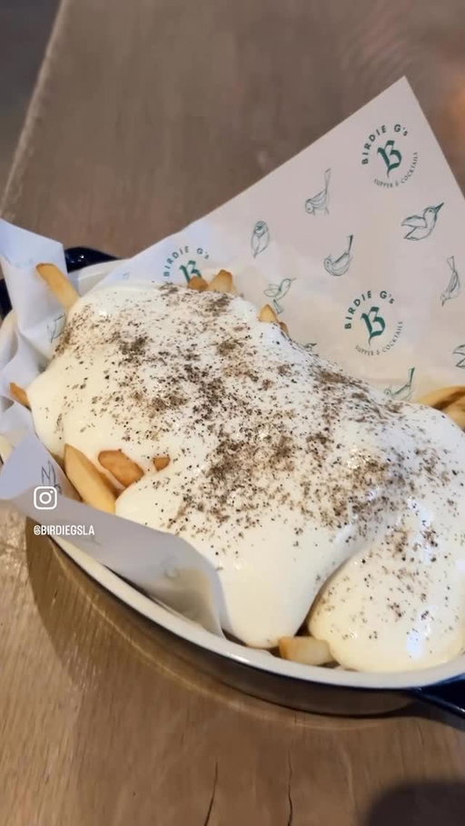 Truffled Quattro formaggi/cacio e pepe fries on the menu @birdiegsla. velvety cheese sauce made of black truffle pecorino, parmigiano, mozzarella & gruyere with lots of cracked @reluctanttrading tellicherry pepper. @birdiegsla #fries #lafoodjunkie #cheese #santamonica #laeats