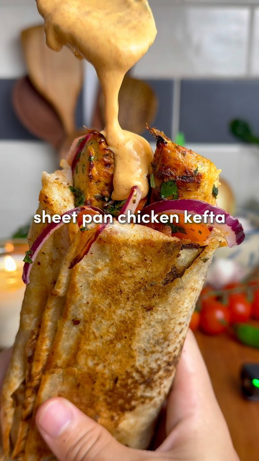 Sheet Pan Chicken Kefta Wraps 🔥

Find the full recipe on my free recipe app “Osta Recipes” on the App Store or Google Play store ‼️

Comment “Recipe” and I’ll send you the  full recipe card for free!! 
Inspo from the recipe king: @cheffinwithzach 

For the Chicken Kefta:
-1.5–2 lbs ground chicken (700-900 g)
-2 tbsp tomato paste
-8 garlic cloves, minced
-2 tsp smoked paprika, 2 tsp cumin, 2 tsp salt, 2 tsp black pepper, 1 tsp turmeric, 2 tsp garlic powder
-1/3 cup fresh parsley, chopped
-1/3 cup fresh cilantro, chopped (optional)
-1 large or 2 medium yellow onions, grated + squeezed dry*
-On top before baking: 4 tbsp olive oil
For the Roasted Garlic:
-2 garlic heads, 1 tbsp olive oil and 1 tsp salt
For the Fresh Salad:
-1/2 large red onion, thinly sliced
-1 cup cherry tomatoes, quartered
-1/4 cup fresh parsley, chopped
-1 tsp salt, 1 tsp pepper & 2 tsp sumac
-Juice of 1/2 lemon
Roasted Garlic Paprika Sauce:
-Roasted garlic cloves, 1/4 cup mayo, 1/4 cup Greek yogurt, juice of 1/2 lemon, 1 tsp paprika + 1 tsp pepper

1. Preheat oven to 400°F (205°C). Slice the tops off two garlic heads, drizzle with olive oil and salt, wrap in foil, and roast for 45–60 minutes until golden and soft. While the garlic roasts, prep the kefta.
2. Grate the onion, squeeze out all liquid with paper towel or cheesecloth. (This prevents watery kefta.) In a large bowl, combine chicken, tomato paste, minced garlic, spices, parsley, cilantro (if using), and the grated onion. Mix with your hands for 2–3 minutes until sticky and well combined.
3. Spread onto the sheet pan in a 1/2-inch (1.25 cm) thick rectangle. With a knife, score into 1-inch strips (2.5 cm). Drizzle evenly with 4 tbsp olive oil.
4. Bake for 12–15 minutes, then broil 2–5 minutes until golden and slightly crisp on top.
5. While baking, toss onion, tomatoes, parsley, salt, pepper, sumac, and lemon juice in a bowl.
6. Squeeze roasted garlic cloves into a bowl, mash, then mix with mayo, yogurt, lemon juice, paprika, and pepper until smooth.
7. On lavash or pita, slather sauce, add 1–2 strips of chicken kefta, top with salad. Roll tight. For extra magic, crisp the wrap in a lightly oiled skillet for 1-2 mins per side.