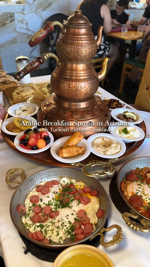 🍳🧆 Definitely a unique spot in Gilbert is Rayoog Cafe. This was my first time having Arabic and Turkish breakfast with this beautiful breakfast spread (called Special Mam’s that includes hummus, salad, baba ghnogh, yogurt, shakshuka eggs, and more). Definitely order the Turkish coffee and baklava with ice cream, Nutella and pistachio to finish off your meal. This can feed 2-3 people for sure and we had plenty of leftovers after. Highly recommend if you’ve never been! 

@rayoogcafe 
📍 78 N Cooper Rd Ste 101, Gilbert, AZ 85233