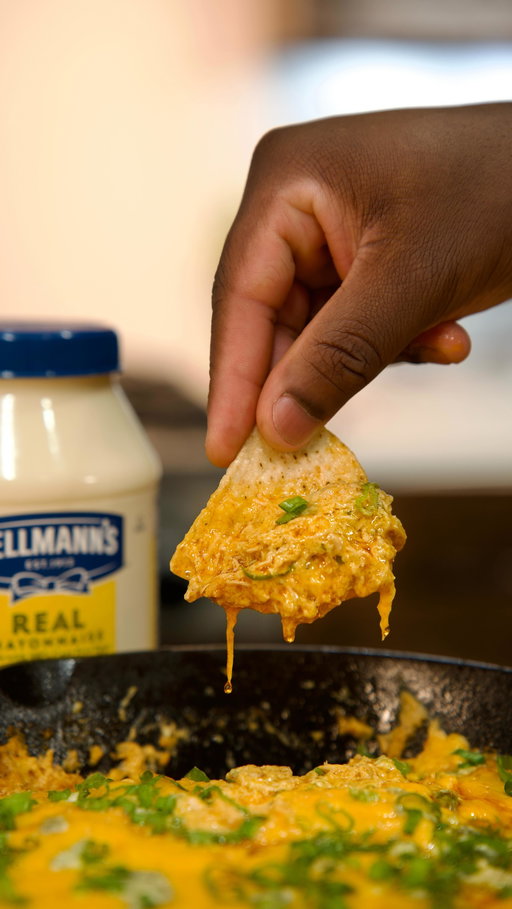 Hellmanns DISAPPEARING BUFFALO CHICKEN DIP RECIPE 
——— 
Football season is back, y’all! 🏈 And you know that means it’s time to bring the heat with some epic game day snacks. Let me show you how to whip up this bold and Creamy Disappearing Buffalo Chicken Dip using @hellmannsmayonnaise #HellmannsPartner
————————
Hellmann’s Buffalo Chicken Dip Ingredients - 
2 Cups finely chopped or shredded cooked chicken (details below)
1/3 Cup cayenne pepper sauce
1 Cup Hellmann’s Mayonnaise 
1 Cup shredded cheddar cheese
2 Tbsp. finely chopped green onions (optional)
1 Tsp. lemon juice
1/4 Cup crumbled blue cheese
———————————————
Shredded Chicken Ingredients 
4 Chicken Thighs 
2 Tsp Garlic powder
1 Tsp. onion powder
1/2 Tsp. smoked paprika 
1/2 Tsp. black pepper
Drizzle olive oil
1 Tsp. salt
———————————
#food #thatsavagekitchen #foodie #foodporn #cooking #recipe #chicken #chickenrecipes #easyrecipes #gameday #gamedaysnacks #appetizers #football