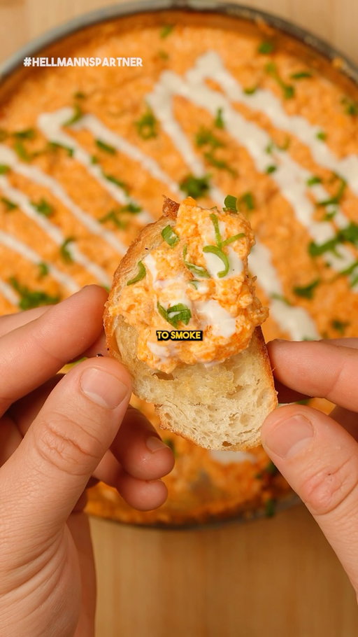 Disappearing Buffalo Chicken Dip 
 
I recreated @hellmannsmayonnaise amazing disappearing Buffalo chicken dip, and it’s as good as it sounds—creamy, cheesy, and loaded with flavor. The name says it all because this dip will vanish fast at any party! The best part? You can grab all the ingredients at Kroger. #HellmannsPartner
 
👇 Full Recipe Below 👇
 
Ingredients:
🔶 2 cups finely chopped or shredded cooked chicken
🔶 1/3 cup cayenne pepper sauce
🔶 1 cup Hellmann’s Real Mayonnaise (or Light Mayonnaise)
🔶 1 cup shredded cheddar cheese
🔶 2 tbsp finely chopped green onions (optional)
🔶 1 tsp lemon juice
🔶 Drizzle with Ranch
 
Instructions:
1. Preheat smoker or oven to 375°F.
2. Toss chicken with cayenne pepper sauce in a large bowl.
3. Stir in mayonnaise, cheddar cheese, green onions, and lemon juice.
4. Transfer mixture into a cast iron skillet or shallow casserole dish.
5. Smoke or bake uncovered for 20 minutes, or until hot and bubbling.
6. Serve with celery, tortilla chips, or your favorite dippers.

#recipe #foodie #carnivore