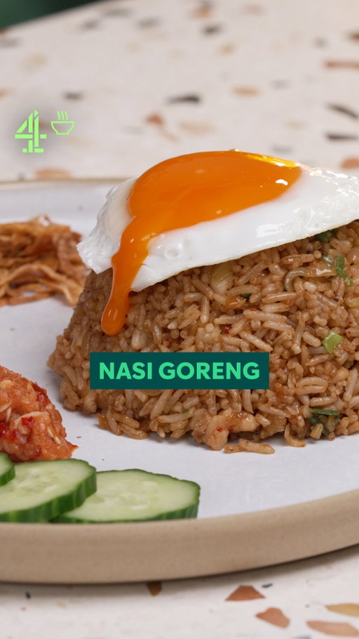 Fried rice hits different in Indonesia. @justinkaarthur may have just discovered the best fried rice on the planet. 

Serves 2  
Cooking time: 20 minutes  

Sambal Terasi Paste  

3 garlic cloves 
2 small shallots, finely chopped 
1 birdseye chilli, finely chopped 
1 tsp of terasi (shrimp paste)  

Sauce  

1 tbsp kecap mains (sweet soy sauce) abc brand  
2 tsp of fish sauce  
2 tsp of dark soy sauce  

 
Additional ingredients  

2 small shallots, finely sliced 
2 cups of cooked basmati rice  
1 chicken thigh, chopped  
1 fried egg 
2 green onion  
1 tomato, sliced  
1/4th cucumber, sliced 
sambal (thai chiili) 
seasoning to taste 

 
Method  

1. Using a pestle and mortar, blend the garlic, shallots, red chilli, and terasi (shrimp paste) into a rough sambal

2. Fry the sambal terasi for a few minutes, then add the shallots and cook for a few more minutes. Add the chicken pieces and fry until fully cooked

3. Next, add in the cooked rice and stir-fry for a few minutes to combine

4. Pour in the sauce and stir-fry for another minute

5. In a hot pan, fry an egg and set it aside

6. Finish with chopped spring onions, and season with salt and pepper to taste

7. Serve with sliced tomato, cucumber and extra sambal on the side

#nasigoreng #rice #friedrice #indonesiafood #easydinner #streetfood