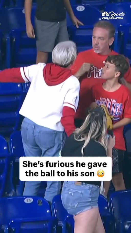 A Phillies fan retrieves a home run ball for his son and this woman is furious she did not get the ball so he gives it to her (via @nbcsphilly)