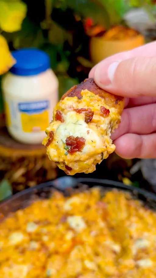 My take on @hellmannsmayonnaise Disappearing Buffalo Chicken Dip 🔥 This dip has earned its name. Tangy, savory, creamy, and has you going back again and again. Full recipe below ⬇️ 
•
Ingredients:
1 French baguette
2 cups finely chopped grilled chicken
1/2 cup bacon bits
1 cup Hellmann’s Mayonnaise
1 cup shredded cheddar cheese
2 tbsp chives
Juice from half a lemon
1/4 cup crumbled blue cheese
Garnish: bacon bits and blue cheese
•
Instructions:
-Preheat pellet grill to 275F
-Grill chicken and chop up
-Cut baguette into small slices and spread on some Hellmann’s Mayonnaise. Place over the heat until crispy golden brown to be used as chips
-Bring together chopped chicken, bacon, mayonnaise, cheeses, chives, and lemon into a cast iron skillet, garnished with bacon and blue cheese
-Place on the smoker for about 30 minutes or until bubbly and dive in 
•
You HAVE to try this at your next get-together (plan to make two because it goes fast). You can find all these ingredients at Walmart 🙌