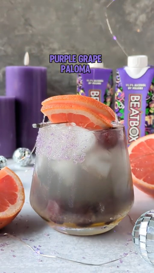 Your weeks forecast: 100% chance of Purple Grape Paloma 💜🍊 Use our store locator link in bio to find Mystic Grape near you! 🍇

Ingredients:
● Agave nectar and purple cocktail sugar for rimming glass
● 4 oz Mystic Grape BeatBox
● 1.5 oz grapefruit juice
● 1⁄2 oz lime juice
● 1⁄2 oz agave nectar
● 2-3 oz grapefruit soda
● Grapefruit slice and frozen purple grapes for garnish
#cocktail #beatboxbeverages #cocktails #grape #paloma