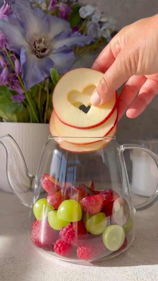 Love making my fruit infused tea at home and it’s a perfect drink to make.

To make the same tea add to a tea pot: 
1/3 cup green grapes cut into halves 
1/3 cup purple grapes cut into halves 
3 slices of apple 
1 slice of orange 
2 cinnamon sticks 
1/2 cup raspberries 
Handful of mint 

Pour hot water on top and allow the water to infuse for 10 minutes before serving. Add honey/maple syrup when serving.

Enjoy 🤍🤍🤍
.
.
.
#easyrecipe #wellness #healthyfood #healthytea #healthyrecipes #tealover #homemadetea #tea #teatime #herbaltea  #teainfusion #teaaddict #homemadetea #detoxwater #infusedtea #caffeinefreetea