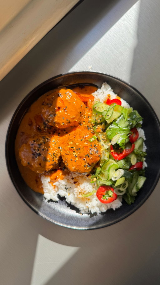 To celebrate making this page my full time job, I’m getting a lil nostalgic with an old recipe. My lemongrass chicken meatballs in coconut red thai curry sauce that have stood the test of time. My most popular recipe back in 2023 and still a certified banger. Serve with a simple cucumber and coriander salad you have yourself one of the tastiest plates of food ever ✨
 
For 4 people:
Cooked rice, I used jasmine
1 small pack coriander, leaves removed from stalks 
½ cucumber, sliced into ribbons
1 chilli, sliced
1 lime juice
1 tsp sugar
1 tsp salt 
1 tsp sesame oil 
2 spring onions, sliced
 
For the meatballs:
500g chicken mince
1 egg
50g breadcrumbs 
2 lemongrass sticks, outer leaves removed 
1 thumb sized piece of ginger, roughly chopped
3 garlic cloves
The coriander stalks 
1 tbsp soy sauce
1 tsp fish sauce
1 red chilli, roughly chopped 
 
For the sauce:
1 tbsp sesame oil 
1 thumb sized piece of ginger, grated
2 garlic cloves, grated
50g red curry paste
1 tin coconut milk
1 tsp fish sauce
1 tsp soy sauce
 
1. Put all the meatball ingredients (bar the mince) into a blender and whiz into a paste, mix into the mince then pop in the fridge for 30 mins. Once done roll into meatballs of your preferred size (bigger the better imo) 
2. Heat 2 tbsp neutral in a large frying pan and add your meatballs, cook until crispy on the outside (6 or 7 mins) then remove and set aside on a plate
3. In the same pan heat 1 tbsp sesame oil and add the garlic and ginger and cook gently for a few mins then add the red curry paste and cook on high for a few more mins.
4. Add the coconut milk, fish sauce and soy and simmer for 10 mins before adding your meatballs and cooking for another 7 mins.
5. Meanwhile make your salad by adding the coriander, cucumber, chilli, spring onion, lime juice, sesame oil, 1 tsp salt and 1 tsp sugar into a bowl and mix well.
6. Serve with rice, your saucy lil meatballs on top and then your salad on the side.