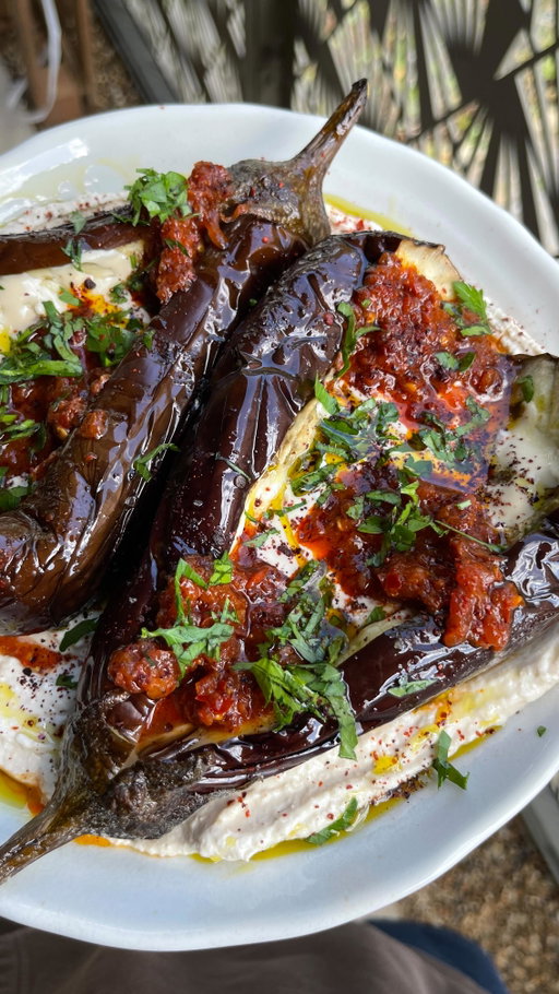 Loaded roasted aubergines with creamy tahini and a juicy, fruity, smoky no cook tomato harissa sauce ✨

I will no longer tolerate aubergine slander here or anywhere else for that matter!!! It’s simply unacceptable, especially when you’re looking at one of the easiest, dare I say sexiest dishes of all time??? Please try it if you don’t believe me…it’s the best way to kiss goodbye to tomato season and welcome aubergine season with open arms 🍅

Recipe on our website!! Go grab it ✨

#aubergine #hummusplate #veganrecipes