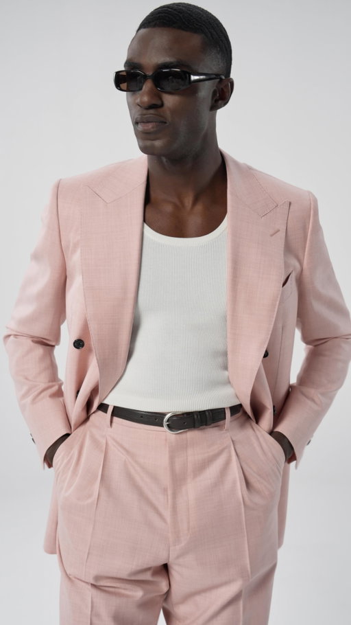 Get ready for a night out in Miami with a bold statement piece built on color and confidence. The pink double-breasted suit is cut from refined S130’s wool and styled clean with brown sneakers and an off-white ribbed tank. For daytime, layer on a cashmere sweater for a more relaxed, elevated take. More ways to wear it, styled by Marc, our Style Director