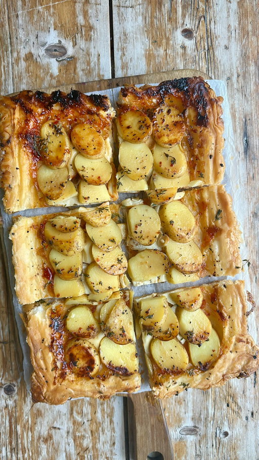 Upside Down Potato, Brie and Chilli Jam Tart

#recipe ⬇️ 

Welcome back to Upside Down Cooking and today we’re making a potato brie and chilli jam tart.

I’m layering par-boiled potatoes onto an oiled and seasoned baking sheet, then adding garlic slivers and chunks of creamy brie. The whole lot is draped with a blanket of chilli jam-slathered puff pastry before being egg washed and baked until gloriously golden.

We then flip it over as we hold our breath and pray to the gods of everything cheesy, to reveal the upside down, potato, brie and chilli jam, ultimate side dish tart of joy!

•	320g (11oz) sheet of ready-rolled puﬀ pastry, roughly 35 x 23cm
•	2 medium potatoes – thickly sliced (skin on)
•	drizzle of olive oil
•	salt and pepper
•	fresh thyme
•	2 cloves garlic – thinly sliced
•	Brie – thick slices
•	2 tablespoons chilli jam or chutney
•	½ tsp chilli flakes
•	1 egg, beaten

You’ll need a large baking tray, roughly 43 x 30cm (17 x 12in), lined with baking paper

Preheat the oven to 220°C (200°C fan/425°F/Gas 7). Unroll the puff pastry, slather it with the chilli jam, leaving a 2 cm border around the outside. Set aside.

Place the sliced potato into salted boiling water and boil for about 3 minutes.  Drain well.

Drizzle the baking tray with olive oil, season with salt and pepper and sprinkle over some fresh thyme.

Lay the potatoes down onto the oiled and seasoned tray in overlapping layers, into a rectangle shape that is slightly smaller than the sheet of pastry, then add the slivers of garlic, followed by slices of brie.

Drape the pastry, jam side down, over the whole lot.  Crimp the edges with a teaspoon, brush with egg wash and score a diamond pattern over the top of the pastry with a knife.

Bake for 25 mins until golden brown.  Allow it to sit for 5 mins before placing a piece of parchment on top, followed by a platter or a chopping board and flip it upside down.

Cut into squares to serve.

#upsidedown #pastry #potatoes #cheese #viralvideos