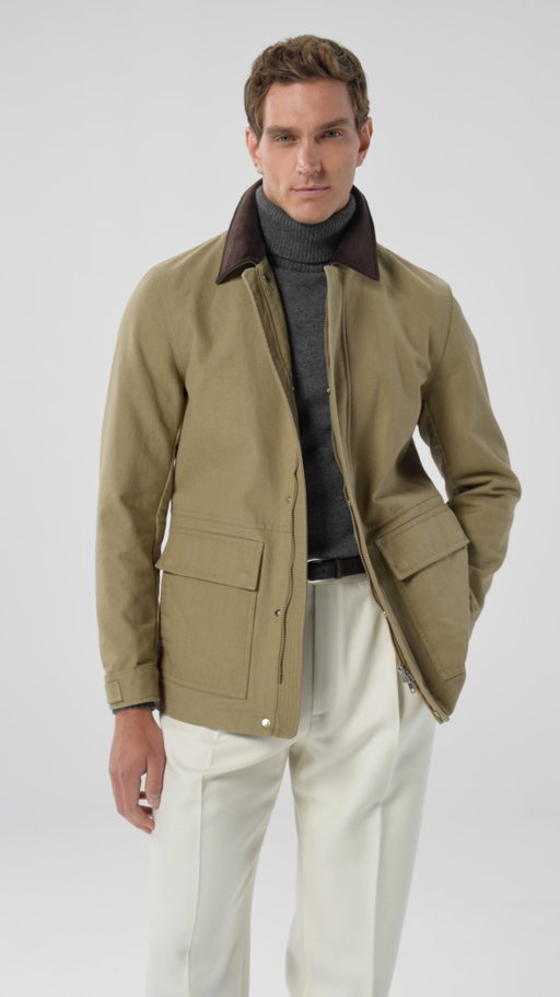 The ultimate weekend go-to, our wrinkle-free herringbone Milano suit in rich brown pairs effortless style with comfort. Layer a soft brown cashmere sweater underneath to complement the suit, and throw on a barn jacket for a more casual vibe. Finish the look with brown sneakers featuring a pop of white stripe for a modern, relaxed finish. Perfect for both laid-back weekends and polished occasions. Discover styling tips from our Suitsupply Style Director Marc and shop this look now online & in-store.