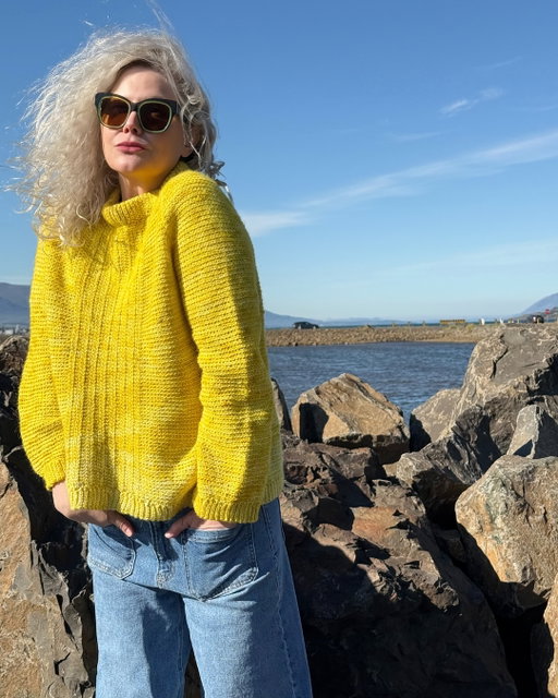 Hand dyed in Portland.
Inspired by Iceland.
Photo taken in Iceland.
Sweater crocheted in Iceland in my favorite colorway from our lineup: Vitti, named after the famous lighthouse in the Reykjavik Harbour. And in case you’re wondering - the ombre effect is intentional!

Coast Sweater by: @aircrochet