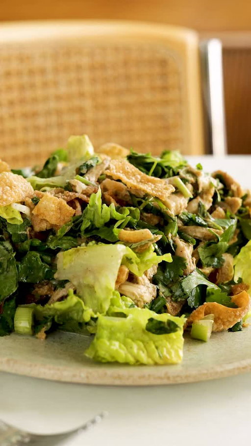 Here’s how to make @ericjoonho’s Crispy Wonton Chicken Salad:

For the Dressing
• 3 tablespoons rice vinegar
• 3 tablespoons toasted sesame oil
• 2 tablespoons peach or apricot preserves
• 2 tablespoons mayonnaise
• 1 tablespoon soy sauce
• 1 teaspoon chili powder
• ½ teaspoon onion powder
• Salt

For the Salad
• 8 ounces cooked chicken meat, torn into bite-size pieces (2 cups)
• 8 wonton wrappers (see Tip)
• Vegetable oil, for frying
• Salt
• 2 romaine hearts, coarsely chopped
• 4 scallions, coarsely chopped
• 1 packed cup coarsely chopped fresh cilantro leaves with tender stems
• 1 packed cup coarsely chopped fresh mint leaves

Make the dressing: In a large bowl, whisk together the vinegar, sesame oil, peach preserves, mayonnaise, soy sauce, chili powder and onion powder, and season to taste with salt.

Prepare the salad: Add the chicken to the dressing and toss.

To fry the wonton wrappers, cut the squares into ½-inch strips, then cut those strips in half crosswise to shorten them. In a medium saucepan, heat an inch of oil over medium to 350 degrees, or until a wonton strip immediately bubbles when added. Carefully add the wonton strips to the hot oil and, stirring constantly with a slotted spoon, fry until puffy and golden, 30 seconds to 2 minutes. Transfer the crispy wontons to a paper towel-lined plate and season with salt.

Assemble the salad: Add the chopped romaine, scallions, cilantro, mint and half of the fried wontons to the bowl with the dressed chicken, and toss to combine. Season with salt as needed. Top with the remaining fried wontons and serve immediately.

Tip
Wonton wrappers are uncooked, flour-based thin sheets of dough, about 3½ inches square. You can find them in the refrigerated section of supermarkets. Store-bought fried wonton wrappers, often packaged as “wonton strips,” are a convenient alternative, though they can be harder to find; look for them near the salad croutons.
