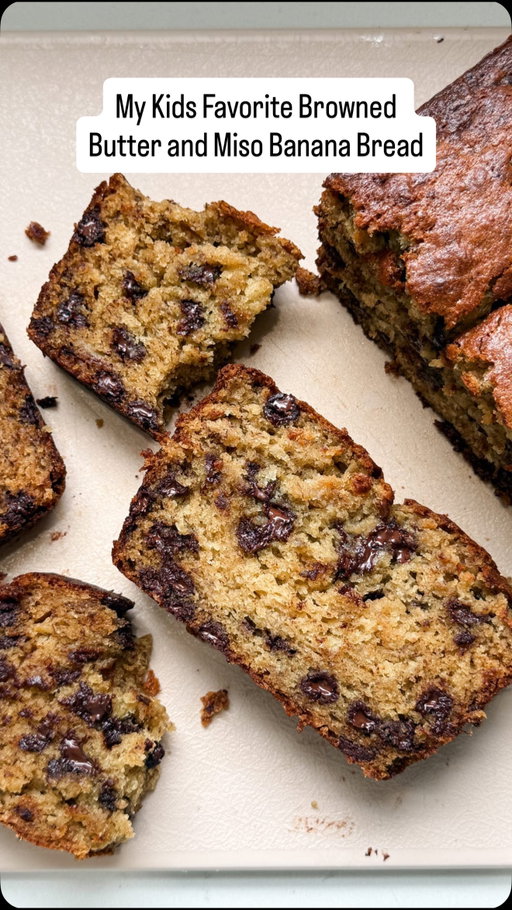 Day 2 of cooking in our temp kitchen while we renovate and I knew I wanted to bake something familiar and comforting to the kids. Banana bread might be the thing I make most — because rotting bananas, duh! 🤪 — and our favorite version combines nutty browned butter with sweet white miso paste. It is perfection and the kids can smell it from a mile away!

Full recipe below, so be sure to save for when you too have 🍌 in utter despair. 💯

Ingredients:
▢ 10 Tbsp (142g) unsalted butter
▢ ¼ cup (60g) sweet white miso
▢ 2 cups (240g) all-purpose flour
▢ 1 tsp baking soda
▢ ½ tsp ground cinnamon
▢ ½ tsp kosher salt
▢ 2 or 3 large ripe bananas (because sometimes I have 2 and sometimes I have 3 😂)
▢ ⅔ cup (135g) light brown sugar
▢ ¼ cup (50g) granulated sugar
▢ ⅓ cup (90g) sour cream
▢ 2 large (100g) eggs, room temperature
▢ 1 tsp pure vanilla extract
▢ 1 cup (200g) semi-sweet chocolate chips or shaved chocolate

1. BROWN THE BUTTER. In a saucepan over medium heat, melt the butter and cook until golden brown and nutty, about 5–7 minutes. Pour into a heatproof bowl, then whisk in the miso paste until smooth. Let cool slightly.
2. MIX DRY INGREDIENTS. In a medium bowl, whisk together the flour, baking soda, cinnamon, and kosher salt.
3. COMBINE WET INGREDIENTS. In a large bowl, mash the bananas with a fork, as smooth as you can get them. Add the browned butter-miso mixture, brown sugar, granulated sugar, sour cream, eggs, vanilla extract, and vanilla bean seeds. Whisk until fully combined.
4. FINISH THE BATTER. Add the dry ingredients to the wet and fold gently with a spatula until just a few streaks of flour remain. Stir in the chocolate chips, being careful not to overmix.
5. BAKE. Pour the batter into a parchment-lined 9x5 loaf pan and smooth the top. Use a butter knife to draw a line down the center (this encourages an even rise). Bake at 350°F for 60 minutes, or until a toothpick inserted into the center comes out clean.
6. COOL AND SERVE. Let the banana bread cool in the pan for 10–15 minutes, then transfer to a wire rack. Slice and enjoy — optionally with a sprinkle of flaky sea salt on top.

#bananabread #breakfastideas #easyrecipe #fallbaking
