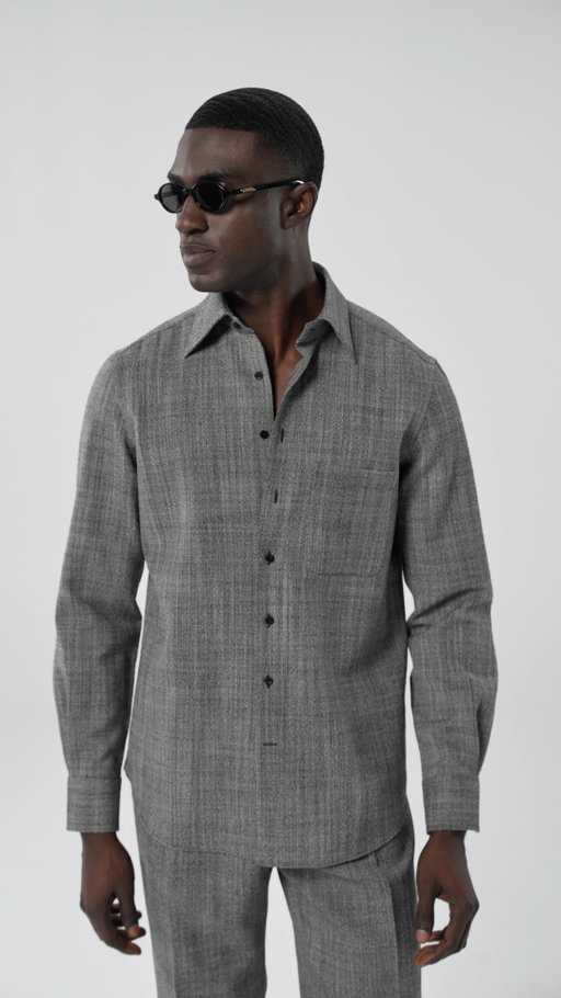 Looking for a casual yet elevated look? Our grey overshirt delivers effortless versatility. Pair it with the matching wide-leg trousers for all-day comfort with a sharp edge, or freshen it up with off-white trousers and flat-sole loafers. As the weather cools, layer on a shirt jacket—pop the collar, fasten the buttons, and give the outfit a sporty, modern finish. Discover styling inspiration from our Style Director Marc.