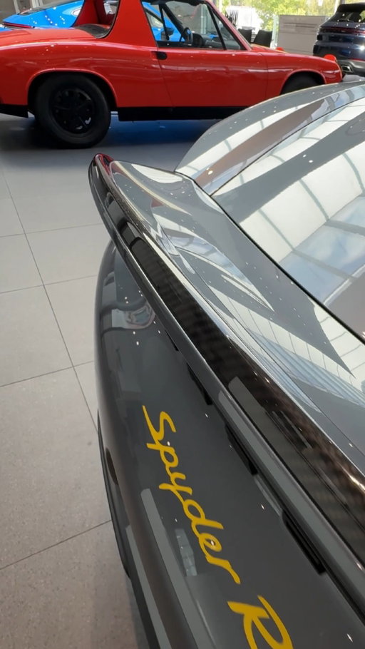 Every gram counts in the 718 Spyder RS. With the Weissach Package, weight saving includes magnesium wheels, titanium exhaust, carbon fiber panels, a manual convertible roof, fabric door pulls instead of handles, and even a sticker in place of the iconic Porsche crest.