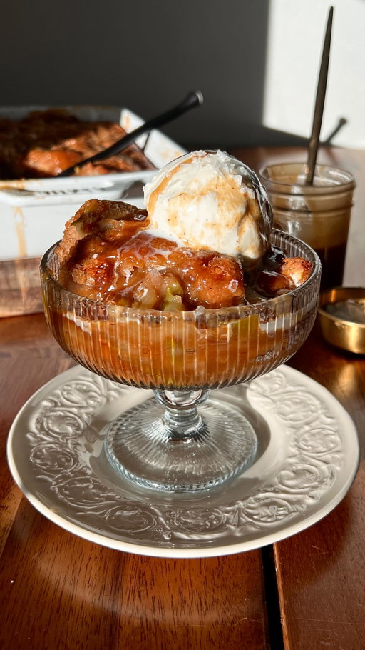 CARAMEL APPLE PUDDING CAKE

essentially fall in a baking dish 🍂 soft and fluffy on top like a cake, gooey on the bottom like a pudding, with tart apples baked all throughout 🍎 the cake is made with @califiafarms Organic Vanilla Almondmilk, which keeps it rich, flavorful, and extra soft ✨ recipe below OR comment ‘APPLE’ to get it sent to you 🤎

#Recipe Details:
Apple Cake:
- 1 1/2 cup (180g) AP flour
- 2 1/4 tsp (10g) baking powder
- 3/4 tsp (5g) salt
- 2 tsp (4g) cinnamon
- 1/2 tsp (1g) apple pie spice
- 1 cup (220g) granulated sugar
- 1/2 (120ml) cup @califiafarms Organic Vanilla Almondmilk
- 1 cup (240g) dairy free Greek yogurt or sour cream
- 2 tsp (8g) vanilla bean paste or extract
- 2 large apples of choice, thinly sliced (& peeled if desired)
Topping:
- 1 cup (240g) brown sugar
- 2 tsp (4g) cinnamon
- 3/4 cup (180ml) water
- 3/4 cup (180ml) apple cider
Easy Salted Caramel:
- 1/4 cup (85g) maple syrup
- 3 tbsp (55g) smooth almond butter
- 2 tbsp (25g) avocado oil or melted coconut oil
- Large pinch of salt

Instructions:
Preheat the oven to 350F. Grease a 10.5x7.5” or 8x8” baking dish w/ vegan butter. 
Batter: In a medium bowl, whisk together the flour, baking powder, salt, cinnamon & apple pie spice. Set aside.
In a large bowl, whisk together the sugar, almondmilk, yogurt & vanilla until well combined. 
Add the dry ingredients to the wet; mix until just combined.
Add the sliced apples & fold coated in the batter.
Pour the batter into the prepared baking dish & spread. Set aside.
Topping: Mix the brown sugar & cinnamon in a bowl. Sprinkle this mixture all over the top of the batter.
Whisk together the water & apple cider in a large measuring cup. Heat the mixture in the microwave for ~2-3 mins, until very hot.
Gently pour the hot water mixture ALL over the brown sugar layer in the pan. DO NOT mix.
Transfer the pan into the oven. Bake at 350F for 50-60 mins, until golden, bubbling & mostly set.
Prepare the salted caramel by mixing all of the ingredients together in a bowl, until smooth.
Remove the cobbler from the oven; cool for  10-15 mins.
Serve w/ vanilla ice cream, salted caramel & flaky sea salt.
Enjoy!
 
#califiapartner