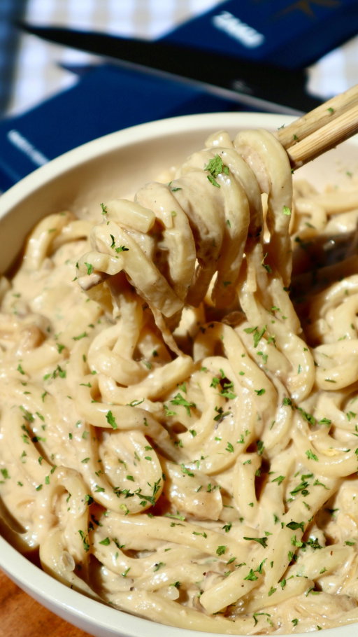 miso caramelized onion udon 🤤

2 large onions, thinly sliced 1 tbsp neutral oil (such as avocado oil) pinch of salt (optional, helps onions caramelize faster) 4 garlic cloves, minced 2 cups heavy cream 2–3 heaping tbsp miso paste 1/2 tbsp soy sauce freshly ground black pepper, to taste 1/2 tbsp brown sugar 1/2 cup grated parmesan cheese (or more, to taste) 24 oz fresh or frozen udon noodles reserved udon cooking water or broth, as needed chopped parsley, for garnish

directions:
heat the oil in a large stainless steel (you can use any pan but i find caramelization is best in a stainless steel pan) pan over medium-low heat. add the onions and a pinch of salt, then cook slowly, stirring occasionally, until deep golden and jammy, about 25–35 minutes. if the onions start to dry out, add a splash of water. 
stir in the garlic and cook for 1–2 minutes until fragrant. 
pour in the heavy cream, then whisk in the miso paste, soy sauce, black pepper, and brown sugar until the miso dissolves. simmer gently for 3–5 minutes.
if using frozen udon, soak in hot water for 1–2 minutes until thawed. drain, reserving about 1 cup of the water. this can be used to loosen the sauce later, although broth will give the noodles more flavor. 
stir the parmesan into the sauce until melted and creamy. 
toss the udon into the sauce, adding splashes of the reserved cooking water or broth as needed to coat the noodles. 
plate, garnish with parsley, and finish with extra parmesan and black pepper if desired.
Enjoy! 

if you’ve been looking for a japanese knife that’s both stunning and reliable, i can’t recommend zaku enough. use my code ‘misojenkitchen’ for $5 off and discover the beauty of japanese craftsmanship through the link in my bio. they’re also hosting a giveaway, you could win your own zaku knife! follow @zakuknife on instagram to find out how to enter.

#japanesefood #udon #caramelizedonion #easydinner #easyrecipe #onepot #onepanmeal #zaku #zakuknife #japaneseknife