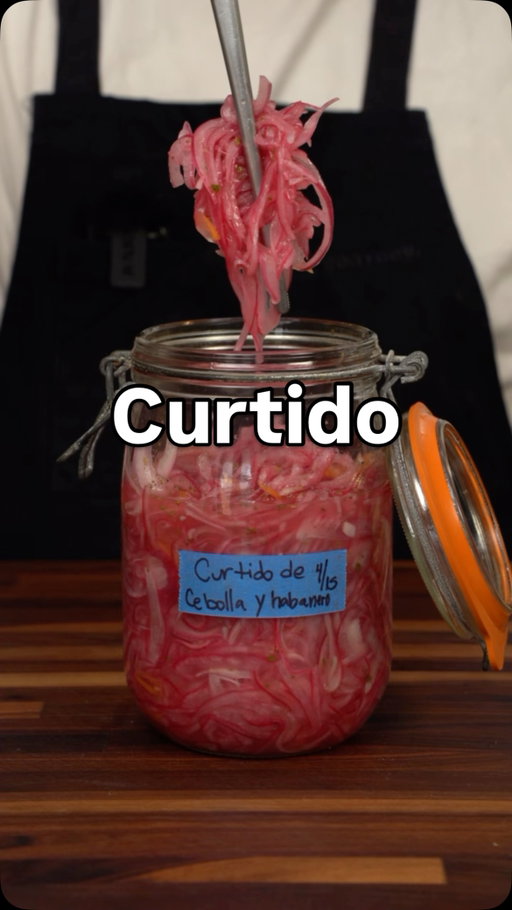 Throw this curtido on everything! Recipe 👇🏽below 

CURTIDO DE HABANERO Y CEBOLLA MORADA
YIELD: 1 QT

555g red onion, julienned
12g habanero, super thin slices (optional)
20g sugar
15g Diamond Crystal kosher salt
240g lime juice, fresh squeezed
3g Mexican oregano, rubbed between your palms to grind
40g white vinegar

In an appropriately sized bowl, combine the onion, habanero, sugar, salt, oregano and massage it all together with clean hands. Allow to marinate at room temp for 30 mins. Add the lime and vinegar, and mix well. Store in the fridge. 
IMPORTANT: TASTE AND ADJUST SEASONING AS NEEDED WITH SALT OR SUGAR.