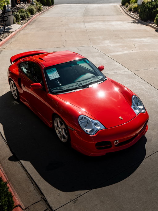 893 miles. 2001 911 Turbo with 6 Speed Manual Transmission in Guards Red over Black Leather interior. This One Owner 996 Turbo has been driven fewer than 1,000 miles since new. The car came to us from a long time Porsche collector that takes great pride in vehicle preservation and this 911 Turbo is a stunning example. During the previous ownership tasteful period correct modifications were performed including a factory stainless partial cage installation, Techart ground effects and rear wing painted in body color installed, upgraded performance coil over suspension, and performance exhaust was installed. The overall appeal and driving character of this 996 Turbo is the ideal poster car for its generation. Our Factory Trained Technicians have performed our comprehensive pre-owned inspection to ensure the car is ready for its next owner. During the inspection process we performed a major service including oil and filter change, engine air filter, pollen filter, spark plugs, engine accessory drive belt, fuel filter, front differential service, transmission fluid change, and brake fluid flush. We replaced all 4 tires and installed a new 12V vehicle battery. We also replaced the clutch system slave cylinder and power steering fluid reservoir as well as engine deck lid struts. All together we performed nearly $15,000 in services so the next owner doesn’t have to.

Price: $139,000
Miles: 893

Original Equipment:

- 6 Speed Manual Transmission
- BOSE Sound System
- CD Changer
- Soft Ruffled Leather Seats
- Large Leather Package
- Heated Seats
- Lumbar Support Left and Right Seats
- Rooflining in Leather
- Front Section of Center Console in Leather
- Sun Visors cover with Leather
- Rear Section of Center Console in Leather
- Steering Column Casing in Leather
- Porsche Crest in Headrests
- Footwell Lighting for Driver and Passenger
- Interior Light Cover in Leather
- Gear Lever Knob in Aluminum and Leather with Shift Pattern
- Park Brake Lever in Aluminum and Leather

Schedule your opportunity to own this incredibly well preserved iconic 2001 911 Turbo Coupe. 719-219-1911

#996turbo #911turbo #porsche996turbo #porsche911turbo #porsche #porschecolorado