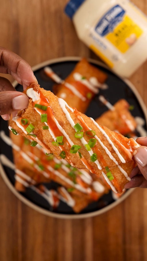 Buffalo Chicken Dip Egg Roll: creamy, cheesy, with the perfect kick! Using @bestfoodsmayonnaise for the ultimate game-day dip, and taking it up a notch with these crispy, golden egg rolls. #BestFoodsPartner

Disappearing Buffalo Chicken Dip (Egg Rolls)
Ingredients:
1 cup Best Foods Mayonnaise
⅓ cup cayenne pepper sauce
1 cup shredded cheddar cheese
1 cup shredded mozzarella cheese
1 tsp lemon juice
1 tsp garlic powder
1 tsp onion powder

Green onions, chopped (for garnish)
Egg roll wrappers + Oil for frying

Ranch dressing and extra hot sauce for drizzling

Instructions:
1.In a medium bowl, combine Best Foods Mayonnaise, cayenne pepper sauce, shredded cheddar, shredded mozzarella, cooked charred chicken, lemon juice, garlic powder, and onion powder. Mix until fully combined and creamy.
2.Take an egg roll wrapper and spoon some of the dip mixture onto the center. Sprinkle a little extra cheese on top.
3.Wet the edges of the wrapper with water, fold the sides in, and roll it up tightly.
4.Heat oil in a frying pan or deep fryer to medium-high heat. Fry the egg rolls until golden and crispy, about 2–3 minutes per side.
5.Remove and drain on paper towels.
6.Drizzle with ranch dressing and extra hot sauce, then garnish with chopped green onions. Serve and enjoy!