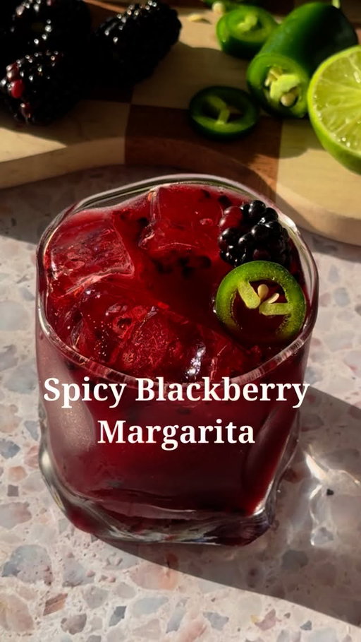 Simple and Spicy 

5 blackberries 
2 slices jalapeno 
.75 oz lime 
.5 oz agave
.5 oz orange liqueur 
1.5 oz tequila 

In a cocktail shaker, combine blackberries, jalapeño, lime juice, and agave. Muddle to release all the juice from the blackberries. Add the orange liqueur, tequila, and ice, and shake until the mixture is cold. Strain into a cocktail glass full of ice and garnish with a blackberry and jalapeño slice. 

#cocktailrecipes #easyrecipes #cocktail #drinksathome #blackberry #jalapeños #margarita #margaritarecipe