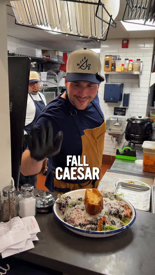 Fall Caesar: Baby Kale, Shaved Brussels, Acorn Squash, Cranberries, Caesar Dressing, Shaved Parm, Topped with a Sourdough Focaccia Crouton