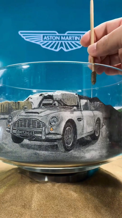 The sands of time. Marking more than 60 years of iconic Aston Martin and 007 moments on #JamesBondDay with this epic piece from @fallinginsand. 

#AstonMartin #INTENSITYDRIVEN