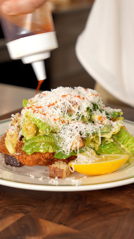 Caesar Chicken Milanese anyone? 🤌

Cooking but also saving marriages

Ingredients

Chicken 
- Chicken breast or chicken thigh (I prefer thigh)
- AP flour
- Egg wash
- Panko bread crumbs
- Salt and pepper

Caesar Salad
- Romain lettuce
- 1 large garlic clove
- 2 achovees
- 1 tsp dijon mustard
- 2 tbsp lemon juice
- 2 egg yolks
- 1 tsp worsecester sauce
- 3-4 dashes tabasco
- 1/2 cup olive oil
- 1/4 cup parmesan
- Croutons (bread, olive oil, salt)

Instructions

Chicken
- Tenderize chicken (don’t overdo it) and season with salt and pepper before coating in flour, egg wash and panko bread crumbs.
- Fry in 350F oil until crispy for about 8 minutes (depends on thickness) and season with salt

Croutons
- Bake pieces of bread in the oven with salt and olive oil at 400F for 10-12 minutes.

Caesar Salad
- Combine chopped garlic, anchovies, dijon mustard, egg yolks, lemon juice, worsecester sauce, tabasco sauce before whisking in olive oil and adding parmesan.
- Add romain lettuce with croutons in the salad dressing bowl and gently mix.