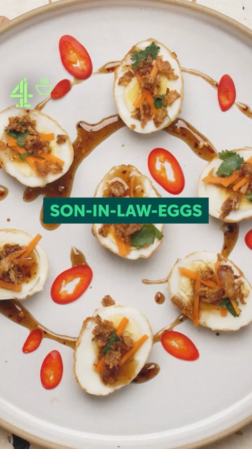 @justinkaarthur went looking for the story behind son-in-law eggs… turns out it’s not as wholesome as we thought.

Serves: 2 
Total time: 25 minutes 

Ingredients 

4 large eggs 
2 tbsp tamarind sauce 
2 tbsp light brown sugar 
1/2 tsp chilli flakes 
2 tbsp fish sauce 
 
Garnish 

Fresh coriander 
Fresh chilli 
Crispy shallots 
1 carrot, sliced 

Method 

1.  Bring a pot of water to a boil. Boil the eggs for 10 minutes

2.  Transfer the eggs to a bowl filled with cold water and ice cubes

3.  Once cooled, peel the eggs and pat them dry with paper towels

4.  To make the sauce, combine the brown sugar, tamarind sauce, fish sauce, and chilli flakes in a pot. Simmer gently until the sugar dissolves

5.  Add a splash of water and stir to loosen the sauce slightly

6.  Deep fry the boiled eggs for a few minutes, turning constantly until they are golden brown

7.  Drain off any excess oil. Once slightly cooled, slice the eggs in half

8.  Serve the eggs drizzled with the sauce and garnish with fried shallots, chopped chilli, coriander, and carrot

#easyrecipe #thaifood #eggrecipe #eggs