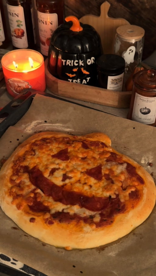 This is your sign to make spooky pizzas for Halloween night 🍕🕯️👻

There’s nothing cozier than a Halloween evening spent at home with candles flickering, a movie playing in the background, and the smell of homemade pizza filling the kitchen. I love making little ghost and pumpkin-shaped pizzas this time of year. It has became one of my annual tradition! It’s such a simple, fun way to celebrate the spooky season and turn an ordinary night into something special 🕸🔮

DOUGH:
500g tipo 00 flour, 7g instant dry yeast, 2 tbsp olive oil, 1 tsp sugar, 320ml warm water

DIRECTIONS:
- In a small bowl, mix the warm water, yeast, and sugar.
Let it sit for 10 minutes, until it starts to foam on top
- In a large bowl, combine the flour and salt. Make a well in the center and pour in the yeast mixture and olive oil.
- Mix with your hands or a spoon until a rough dough forms. Transfer to a floured surface and knead for 8–10 minutes
until smooth and elastic. (Or use a stand mixer with a dough hook.)
- Shape the dough into a ball and place it in a lightly oiled bowl. Cover with a clean towel and let rise in a warm spot for 1½ to 2 hours, or until it doubles in size.
- Punch down the dough to remove air, then divide it into 2 equal pieces.
- Shape each into your Halloween theme: pumpkin, ghost…
- Add your favorite sauce, cheese, and toppings 🍅🧀
- Bake for 40min at 200 degrees (390F) and it’s ready to serve 🤎
.
.
.
.
#halloweenfood #halloweenrecipes #halloweenrecipe #halloweenpizza #pumpkinpizza #fallrecipes #fallrecipe #pizzarecipe #recipereels #recipeidea #recipeinspo #recipeinspiration #cookingathome❤️ #halloweenseason #halloweenseason🎃 #halloweenmonth #halloweenmood #halloweenmood🎃 #halloweeniscoming #halloweenvibes🎃 #halloweenaesthetics #halloweengirl #spookyseason #spookyseason🎃 #spookyszn🎃👻 #spookyszn #spookyvibes #spookyaesthetic #spookygirl #halloweengirl