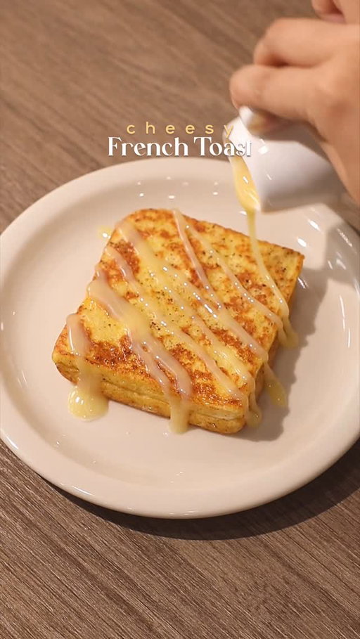 🧀🍞 Cheesy French Toast

📝 Recipe

Bread
Sliced Cheese
1 Egg
30ml • Milk
1 tsp • Ground Cinnamon
1 tbsp • Butter
30g • Sweetened Condensed Milk

Instructions:

* Bread & Cheese:
- stack bread with sliced cheese inside

* Egg Mixture
- crack open 1 egg in a plate
- pour milk
- add ground cinnamon
- whisk the egg mixture until it’s mixed well

* Cooking; Bread
- heat the pan and melt butter in medium heat
- dip / coat the bread all over with the egg mixture
- fry the bread on the pan, flip, add another butter
- cook until both sides are golden brown

* Finishing; Cheese French Toast
- drizzle sweetened condensed milk on the bread and enjoy!

//

Have you ever put cheese singles in your french toast?! If you haven’t, go to the kitchen now and make this! It’s easy to make and you can definitely find all the ingredients at home. I don’t think you understand that this has become my new obsession. 🤭

Btw hi guys! I have been away for long, sorry! I hope y’all are doing alright. 🤎

—

#frenchtoast #homecafe #홈카페 #asmr #homecooking #cookingathome #easyrecipes #easyrecipesathome #quickrecipes #breadrecipes