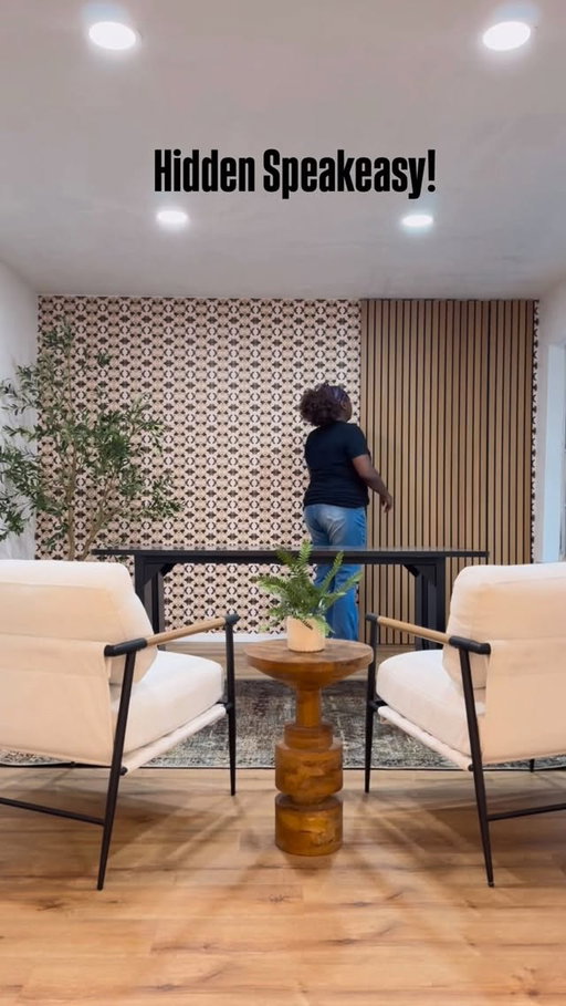 We made this longer living room more functional by framing up a wall and creating a hidden speakeasy area! I’m loving it! #remodeling #interiordesign #homeimprovement