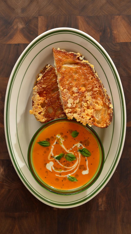 It’s the season for Grilled Cheese and Roasted Tomato Soup!!! 🧀🍅

This recipe is like a warm hug 🫂

Download the @Instacart app today and try the recipe below! #ad #Instacart Partner 

Ingredients

Tomato Soup:
-10 medium sized tomatoes
-1 garlic head
-1 red Onion
-1 cup stock
-1/2 cup Cream
-1 tsp sugar
-Salt and pepper
-Basil
-Olive Oil

Grilled Cheese:
-Cheddar, mozzarella, gruyere
-Sourdough bread
-Butter

Instructions

Tomato Soup:
-Lay the tomatoes, garlic, and red onion on a baking sheet. Drizzle with olive oil before seasoning with salt and baking in the oven at 400F for 45 minutes.
-Blend the roasted ingredients until smooth and add the puree in a pot to simmer with stock, sugar, salt and pepper for 20 minutes.
-Finish with cream towards the end.

Grilled Cheese:
-Grate equal parts of cheddar, mozzarella, and gruyere.
-Spread butter on two slices of sourdough bread before flipping them and equally adding the cheeses in between the two slices.
-Sear both buttered sides on medium-low heat until crispy.