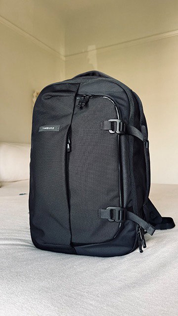 Waiting at baggage claim, wondering if your bag made the connection. Our Never Check Backpack solves that. It’s a carry-on size with room to spare, expandable when you need it, and organized to keep everything in its place. What’s your travel essential?