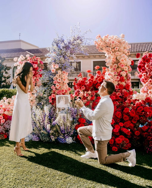 Ten years and millions of memories later, @robdyrdek brought me right back to where it all began. Except this time we were surrounded by flowers and picture frames from every year of our marriage.⁣
⁣
And just when I didn’t think it could get any more special.. He got back down on one knee and said “I know you like shiny things, but will you marry me with a paper ring?”⁣
⁣
Then as I was saying “YES!” through an equal amount of tears and laughter, our babies (who were hiding behind the bushes!) came out to share this special moment with us 😭💍♾️⁣
⁣
I knew I married right all those years ago. But to spend a lifetime with someone who chooses to make love an art form is unlike anything I could have ever imagined.⁣
⁣
I love celebrating the big things, the little things, and every beautifully ordinary day in between. And I am so incredibly grateful that our children get to grow up seeing what love looks like when it’s nurtured, protected, and endlessly re-written by two hearts who never stop choosing one another 🤍