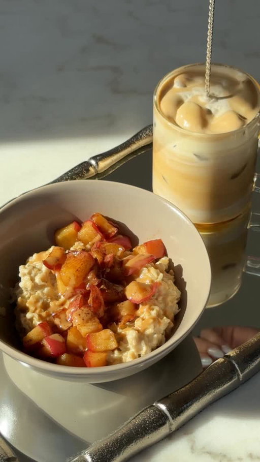 Apple pie oats & maple iced latte 🍎🍁

The coziest fall breakfast and coffee combo made with ingredients from my local @freshthyme market 🛒🛍️ 

Products:
Bobs Red Mill Protein Oats
MaraNatha Peanut Butter Spread
Fresh Thyme Organic Maple Syrup
Simply Organic Cinnamon
Organic Valley Whole Milk
Organic Valley Whipping Cream
Backroom Coffee Roasters Espresso
Honey Crisp Apples

Apple Pie Oats:
Bring 2 cups whole milk to a boil. Add 2/3 cup oats and reduce heat to medium low. Let cook for 15 minutes, stirring occasionally. 
While the oats cook, dice 1 honey crisp apple. Add to a pan with a splash of oil, maple syrup, and cinnamon. Cook over medium heat until the apples become soft and lightly browned.
Once everything is done cooking, assemble your bowl by first adding the oats then the apples. Top with a drizzle of peanut butter and a dash of cinnamon.

Maple Iced Latte:
Add ice to a glass. 
Add a splash of maple syrup and about 1/2 cup whole milk.
Brew 1 shot of espresso and add to your cup.
In a separate glass, whisk together 2 tbsp heavy whipping cream, 1 tbsp maple syrup, and a dash of cinnamon. Add to the latte.
Stir and enjoy!

#freshthymemarket 
#freshthymefinds #freshthymepartner #oats #oatbowl #proteinoats #icedlatte #coffee #icedcoffee #fallbreakfast #ad #sponsored