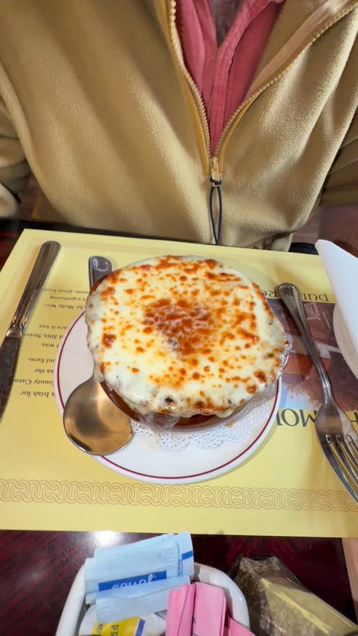 Enjoying French onion soup