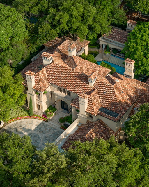Rising behind a circle drive and flanked by Mediterranean cypress trees, 15 Robledo Drive evokes the timeless romance of a European villa. Within the gates of Los Arboles, Preston Hollow’s most exclusive enclave, the estate reveals itself like a scene from the Tuscan countryside — limestone cladding, ironwork arches, and sunlit harmony throughout. Designed by Robert Trown and recently updated by J.R. Cattington Interiors, the home balances Old World character with modern livability. Reclaimed oak floors, hand-hewn beams, and arched openings connect a sequence of light-filled rooms with generous ceiling heights. A richly paneled library, formal living and dining areas, and a butler’s pantry lend themselves to both intimate gatherings and grand entertaining. The kitchen features custom millwork and veined stone, flowing into a cheerful breakfast nook, relaxed family lounge, and study. Across the home, eight fireplaces weave a thread of warmth and elegance. The main-level primary suite feels like a private wing, complete with dual baths and boutique-style closets. Upstairs, two guest suites rival luxury hotels, each with its own fireplace and balcony, alongside a fitness room, bonus space, and ample storage. Outdoors, a waterfall-fed pool, lush gardens, pavilion, putting green, and loggia with fireplace and kitchen make everyday living exceptional. Control4 automation, dual garages, and a private elevator ensure the home lives as effortlessly as it looks — a rare blend of updated comfort and classic estate character.

15 Robledo Dr.

Listed by CompassDFW Agent @halumfinehomes

#CompassDFW #DFWRealEstate #DallasRealEstate #DallasHomeForSale #DallasTX