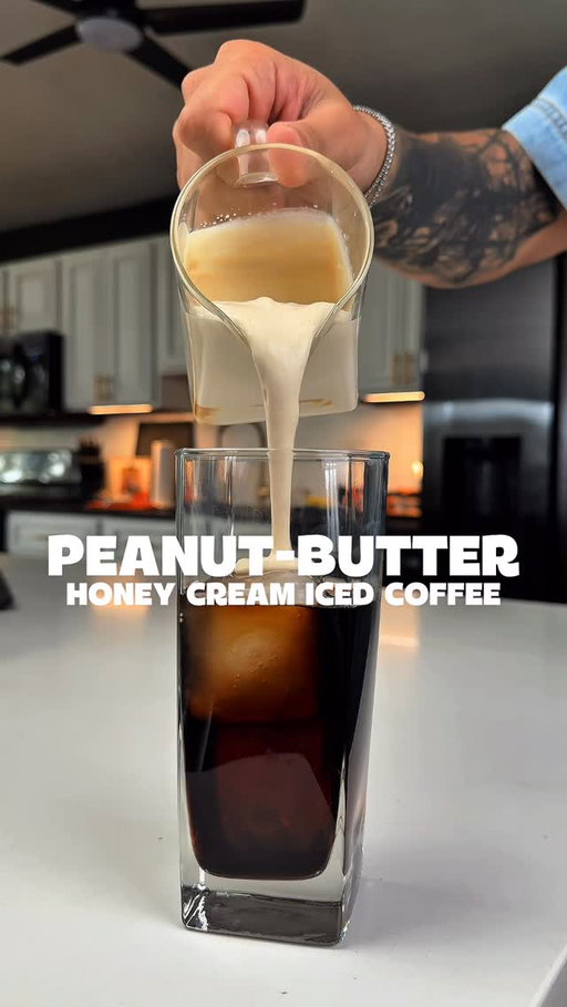 Tired of the same old coffee? This creamy peanut butter coffee will change everything.

Here’s how: 1 tbsp Honey 3 tbsp Peanut Butter (melt it for easier mixing) 3 tbsp Heavy Whipping Cream 2 tbsp Milk → Whip it with a frother until thick and silky

Pour over: Ice + Cold Brew Top with your creamy peanut butter mix Dust with cocoa powder and stir

It’s smooth, nutty, and better than any store-bought drink.
 #Coffee #IcedCoffee #PeanutButterLatte #HomeCafeVibes #CoffeeLovers #EasyRecipes #MorningRitual