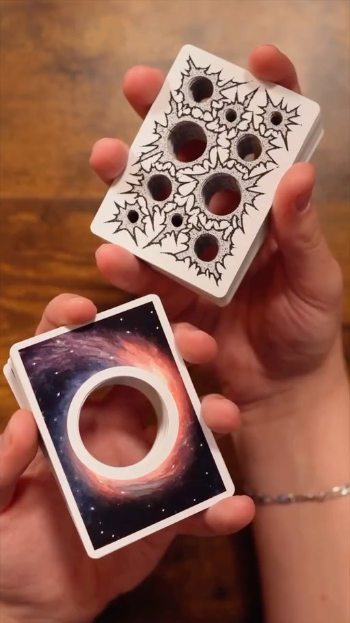 Which deck with holes do you like better? 😮🕳️
•
Cards by: 
@theorbitdeck 
@missingnewyork 
•
#cards #card #playingcards #playingcard #shuffle #shuffles #shuffling #cardistry #danielhuckins #pov #asmr #satisfying #hole #holes #igreels #reel #reels